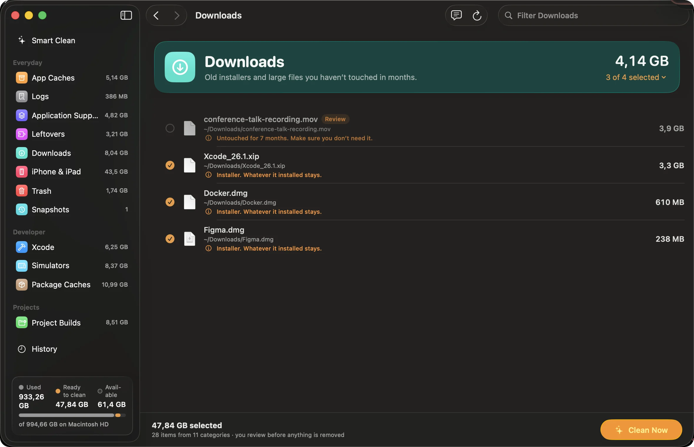 Downloads category listing old installers and a large video marked for review.